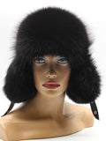 Front view of all-black fox trapper hat with full brim and fox flaps covering the ears