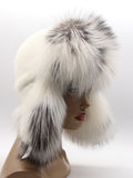 Arctic fox fur framing the face on white mink ushanka with ear flaps down