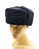 Side view black karakul fur ushanka earflaps up