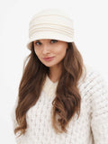 Side profile of woman wearing beige wool cloche hat