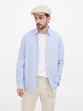 Man wearing beige linen cap full body beige pants casual