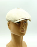 Beige linen newsboy cap mannequin three quarter left view structure