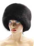 Front view of black arctic fox hat framing the face with a wide fur band