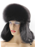 Front view of black arctic fox ushanka framing the face with fox-lined ear flaps