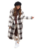 Woman in black 8-panel newsboy cap and checked coat front view