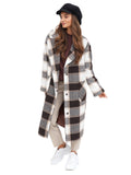 Woman in checked coat wearing black cashmere baker boy cap full body view