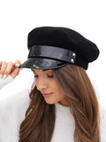Woman in black cashmere Breton cap angled lifestyle shot white background
