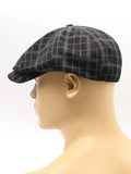 Black check newsboy cap mannequin side view brim detail