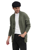 Three quarter view man wearing black flat cap with olive bomber jacket hands crossed
