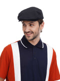 Man wearing black flat top baker boy hat torso front view alternative angle navy polo