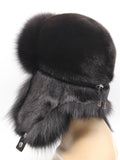 Back three-quarter view of black fur trapper hat with mink flaps tied at the nape