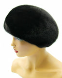Black high-crown mink beret right profile showing volume dome and dense mink fur texture