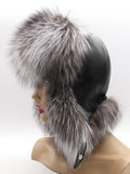 Back three-quarter view of black leather crown with silver fox flaps tied back