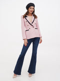 Black linen beret for women full length front view with pink tweed blazer and dark flared jeans