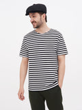 Full body man black linen cap striped tee black pants