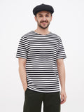 Man standing black linen cap full body casual outfit