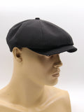 Man in black linen driving cap outdoor summer casual style