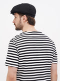 Back view black linen newsboy cap showing 8-panel crown