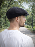 Black linen newsboy hat side view mens summer headwear outdoors