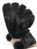 Black mink and black suede striped fur hat hood with black fabric ties and pompons on female model, front view showing all-black texture stripe