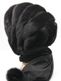 Side profile black mink black suede striped fur hat hood on mannequin showing all-black stripe depth and fabric ties
