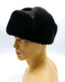 Side view black mink fur hat and suede bomber ushanka