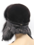 Rear view of black mink and fox ushanka with flaps tied back and snap strap visible