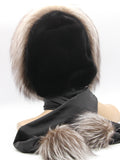 Three-quarter back view black mink fur hood wrap showing scarf tail with silver fox pompon