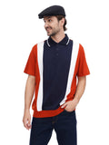 Man wearing black flat top cap casual stance hands in pockets with colorblock polo