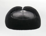 Side profile black sheepskin ushanka earflaps display