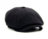 Black wool newsboy cap eight-panel angle view