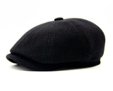 Black wool newsboy cap panel stitching seam