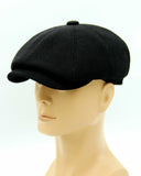Black wool newsboy hat back view on mannequin