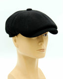 Black wool newsboy hat front view on mannequin