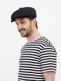Side angle black wrinkled linen newsboy cap slouchy