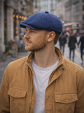 Blue cotton newsboy cap mens side view cafe setting Gatsby style