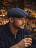 Man wearing blue glen plaid cotton newsboy cap front view urban
