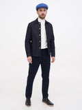 Man wearing blue linen newsboy cap full body black denim jacket outfit