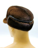 Side view brown mink cap with earflaps folded down