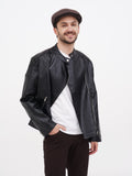 Man in brown wrinkled linen newsboy cap full body casual outfit