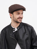 Side profile brown linen newsboy cap showing 8-panel crown construction