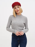 Front view of woman in burgundy lined linen Breton cap and gray sweater