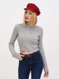 Close-up angle of woman in burgundy lined linen Breton cap with gray knit top