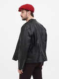 Back view man wearing burgundy linen newsboy cap with black leather jacket showing 8-panel construction