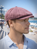 Man wearing burgundy linen newsboy cap front view summer outdoor
