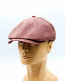 Burgundy linen newsboy cap side angle on mannequin
