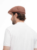 Back view of man wearing cappuccino 8-panel baker boy hat showing construction detail