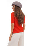 Side profile of woman wearing cappuccino brown cotton baker boy cap with long hair