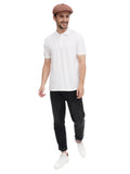 Full body shot man wearing cappuccino 8-panel flat cap with white polo and black pants