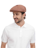 Man in cappuccino newsboy cap 8-panel construction side profile with white polo shirt